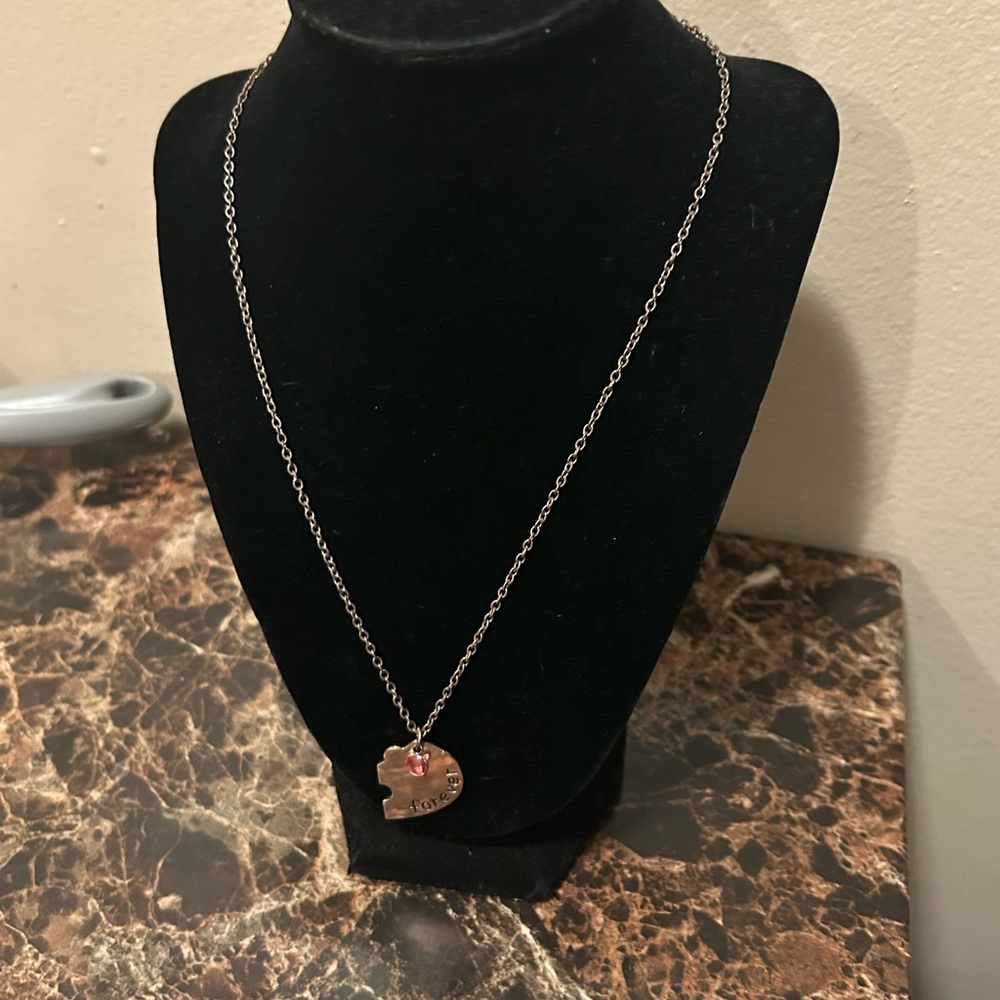 Silver tone heart puzzle friendship necklace inscribed with forever